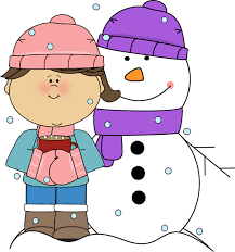 A girl and a snowman are standing next to each other.