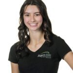 Smiling woman wearing a black Rigert Elite Gymnastics shirt.