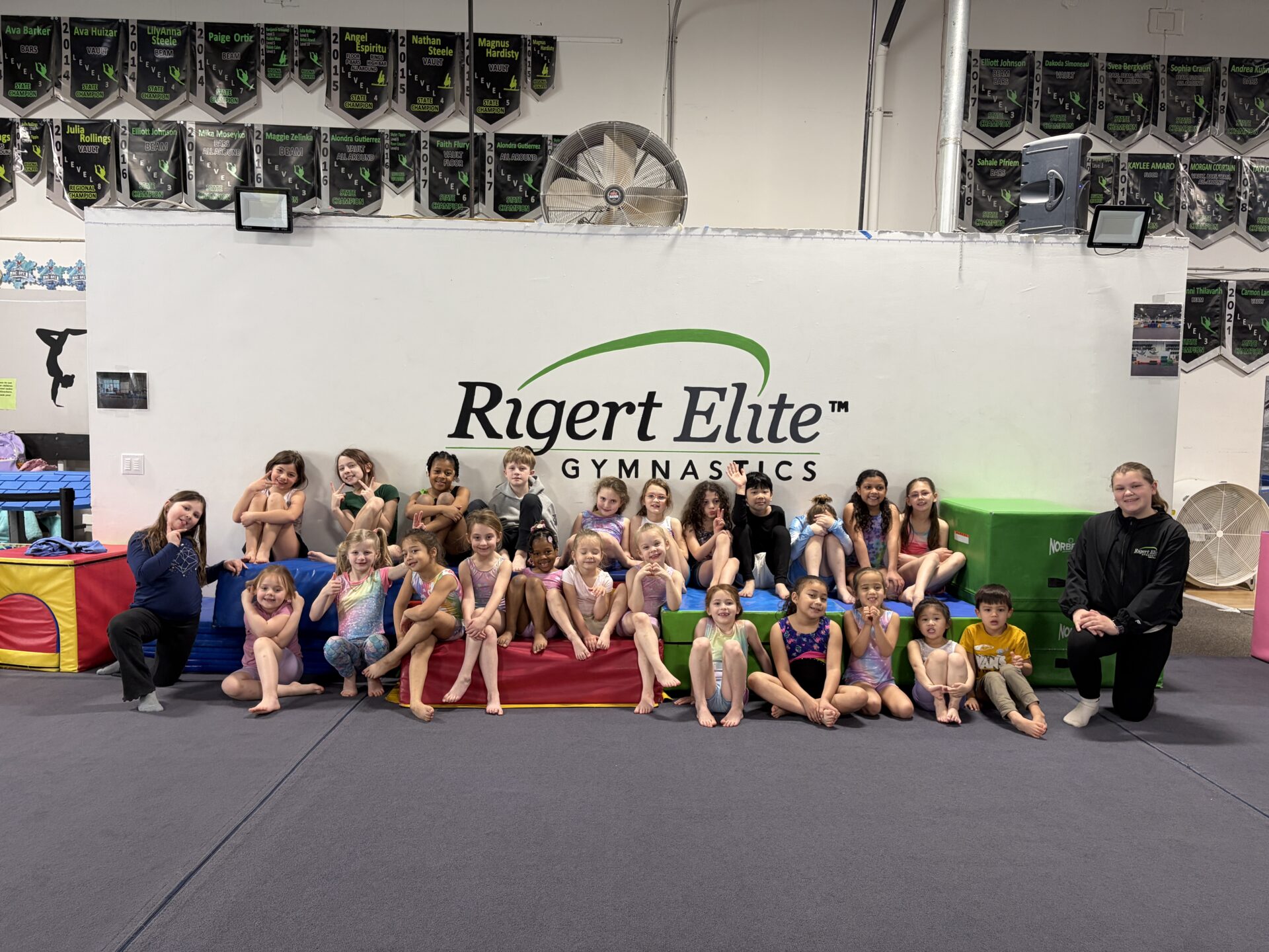 Gymnastics class group posing at Rigert Elite
